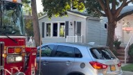Police search for suspect after Queens house fire kills two