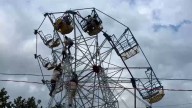 Video: Chaos as ferris wheel tilts at temple fair, riders left hanging mid
