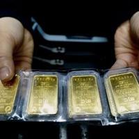 Vietnam jails former officials over gold bar graft: state media