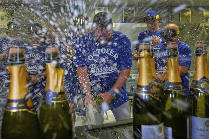 American League-best Blue Jays beat Royals 8-5 and clinch their 1st postseason berth since 2023