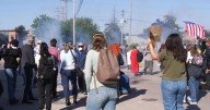Federal agents fire chemicals as protesters try to block car at immigration site outside Chicago