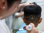 Chinese hair salon offers military-themed haircuts to children