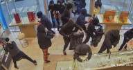 Video shows mob of armed robbers swarm California jewelry store in smash