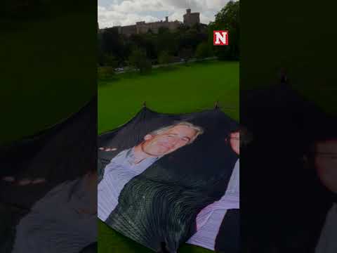 Giant Photo Of Trump And Epstein Unfurled In Windsor Ahead Of UK Presidential Visit