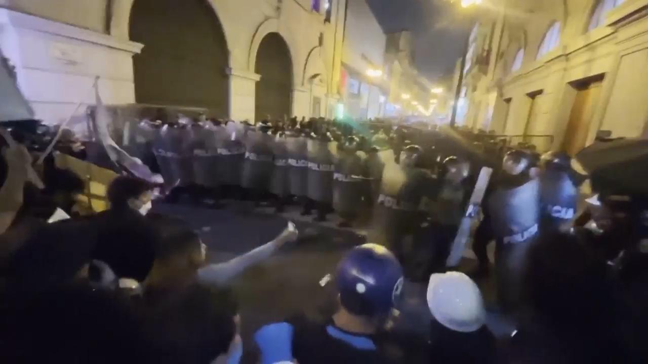 Tear gas fired as police crack down on young demonstrators marching in Peru capital