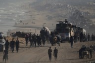Israeli troops press forward into Gaza City as Palestinians flee