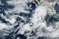 Lorena becomes a hurricane off the western coast of Mexico as Kiko travels over open waters