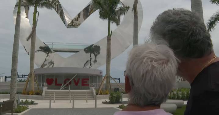 Neighbors discuss their approval or disapproval of new heart sculpture in Port St. Lucie