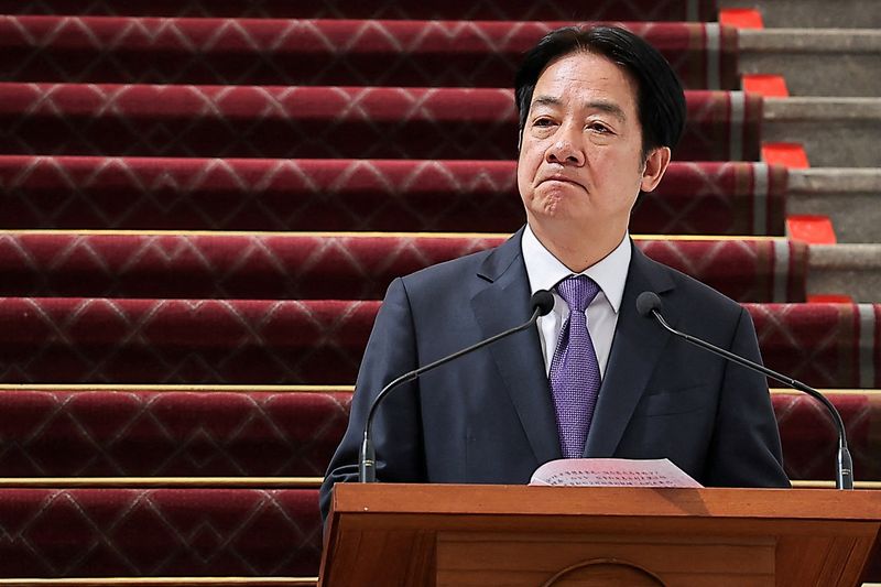 On day of China's war parade, Taiwan president criticises strongmen cults