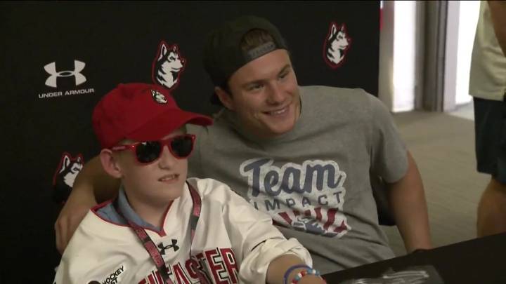 Northeastern University men’s hockey hosts special signing ceremony for 11