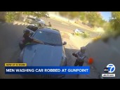 Men robbed at gunpoint in Woodland Hills driveway