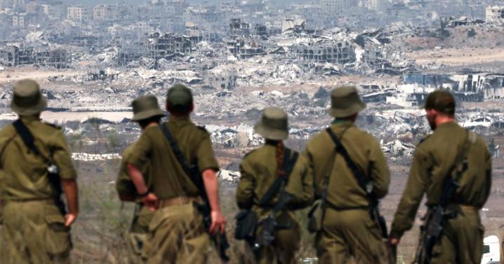 Thousands of Israeli reservists report for duty, as military chief clashes with ministers