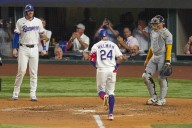 Michael Helman hits 2-run HR, make catch to prevent 2-run HR, as Rangers beat Brewers 5