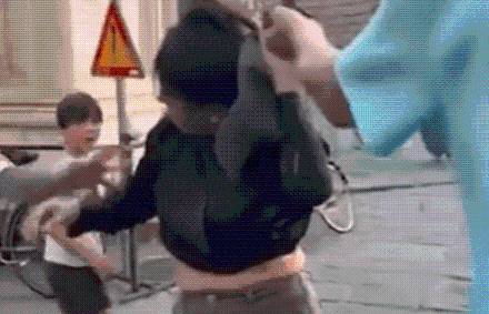Shock moment ‘pregnant pickpocket’ is grabbed by her hair by husband who ‘spotted her stealing from his wife’