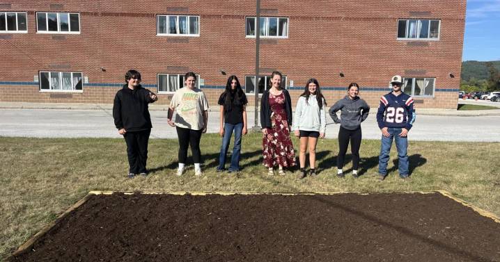 Mill River High School students plant Holocaust remembrance daffodil garden
