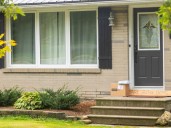 Two Ontario residents facing hate-related charges after swastika mowed into front lawn