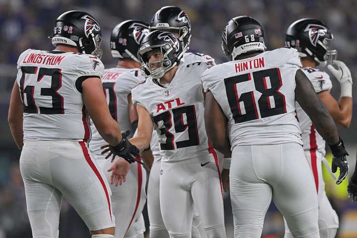 Falcons kicker Parker Romo meets star Leonard Floyd during postgame interview