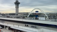 Plane to Boston stops takeoff in Los Angeles as cargo jet crosses runway