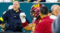 Washington Commanders star carted off field surrounded by teammates after devastating injury blow against Packers