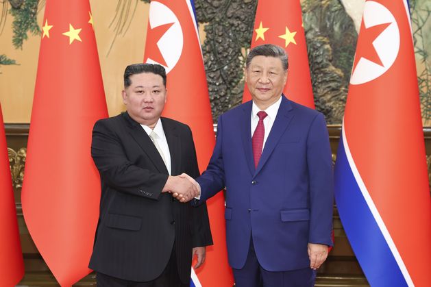 China’s Xi and North Korea’s Kim pledge deeper ties during meeting in Beijing