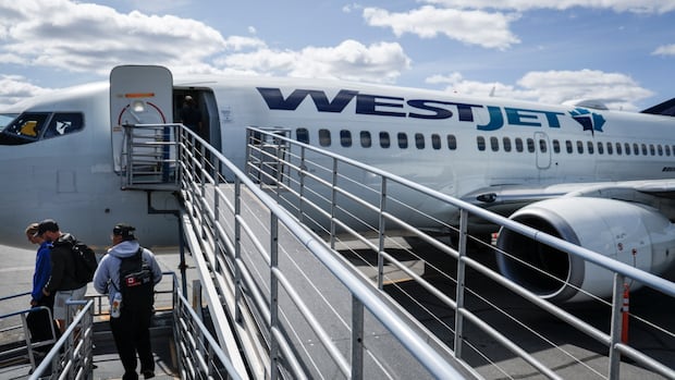 WestJet flight attendants seek to address alleged unpaid work in new agreement