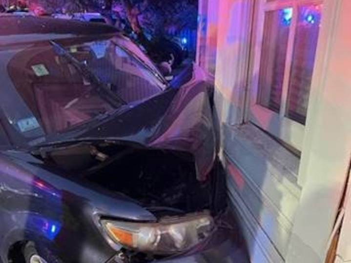 Driver injured after medical emergency causes car crash into house in Acton