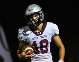 Reilley throws and runs Holy Cross past Buena -