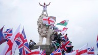 Supporters of far-right activist Tommy Robinson clash with London police during massive protest