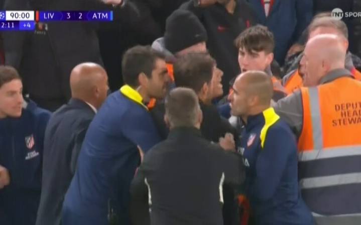 Fuming Diego Simeone held back by security as he clashes with Liverpool fans