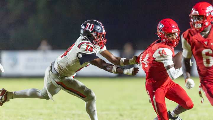 See the photos! Vanguard football meets with Dunnellon in rivalry game