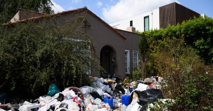 Is the 'Trash House' in Fairfax District a hoarder home or an elaborate recycling project?