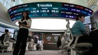 Asian shares trade mostly higher after Wall Street snaps its 3