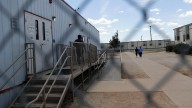 Bottled water sold for $1.21, dismissed medical pleas and faith tested at family detention facility