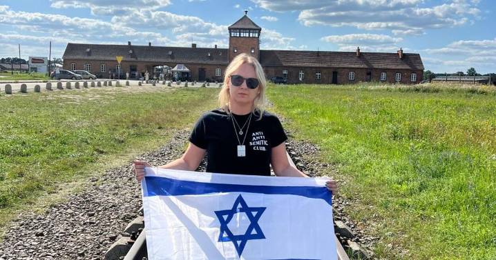 Jewish educator harassed at Auschwitz for holding Israeli flag