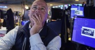 Wall Street ticks toward another record as Tesla vrooms higher