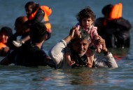 Britain suspends refugees' family reunion applications to toughen rules