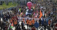 Strikes and protests roil France, pitting the streets against Macron and his new prime minister