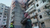 Ukraine government building damaged in Kyiv in the largest Russian attack since the war began