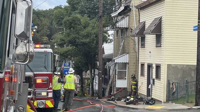 4 firefighters injured by power line while battling South Side Slopes fire