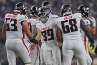 Falcons kicker Parker Romo meets star Leonard Floyd during postgame interview