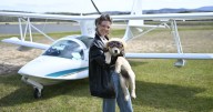 Up, pup and away: teen and puppy aim to break solo flying record