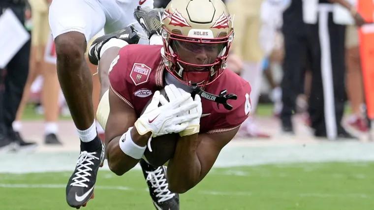 Florida State WR Squirrel White trampled by fans during Virginia field rush, sparking concerns
