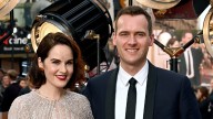 Downton Abbey star Michelle Dockery debuts baby bump alongside husband Jasper Waller