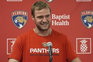 Florida captain Aleksander Barkov needs help getting off ice after apparent leg injury