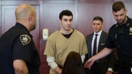Judge rejects top state charges in Mangione case