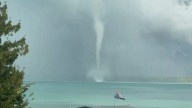 Watch: Tornadic waterspout spins over Michigan lake