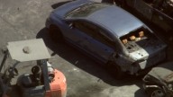 Body found in burned car at South Los Angeles tow yard