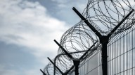 Kansas officer charged with murder after inmate dies by suffocation