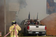 Police remain on scene at burned out Michigan church after shooting and fire leave 4 dead, 8 wounded