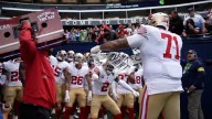 Watch Trent Williams, Deommodore Lenoir rip up Seahawks fan's sign before game
